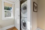 Laundry room with entrance to beautiful backyard